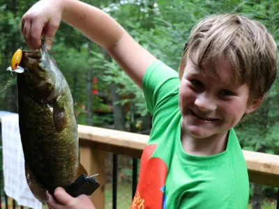 Cohen Elson holding a 18.5 inch smallmouth Bass
