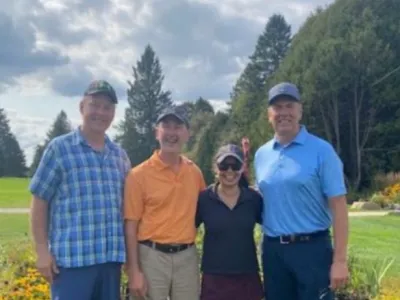 The 2024 winning team, Mike, Tim, Donna and Bruce, on the golf course