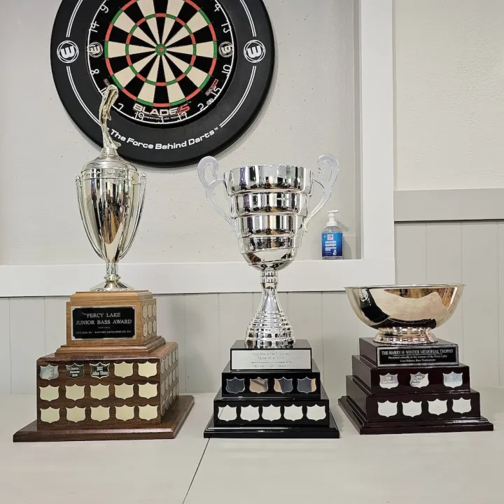 Three trophies on a table.